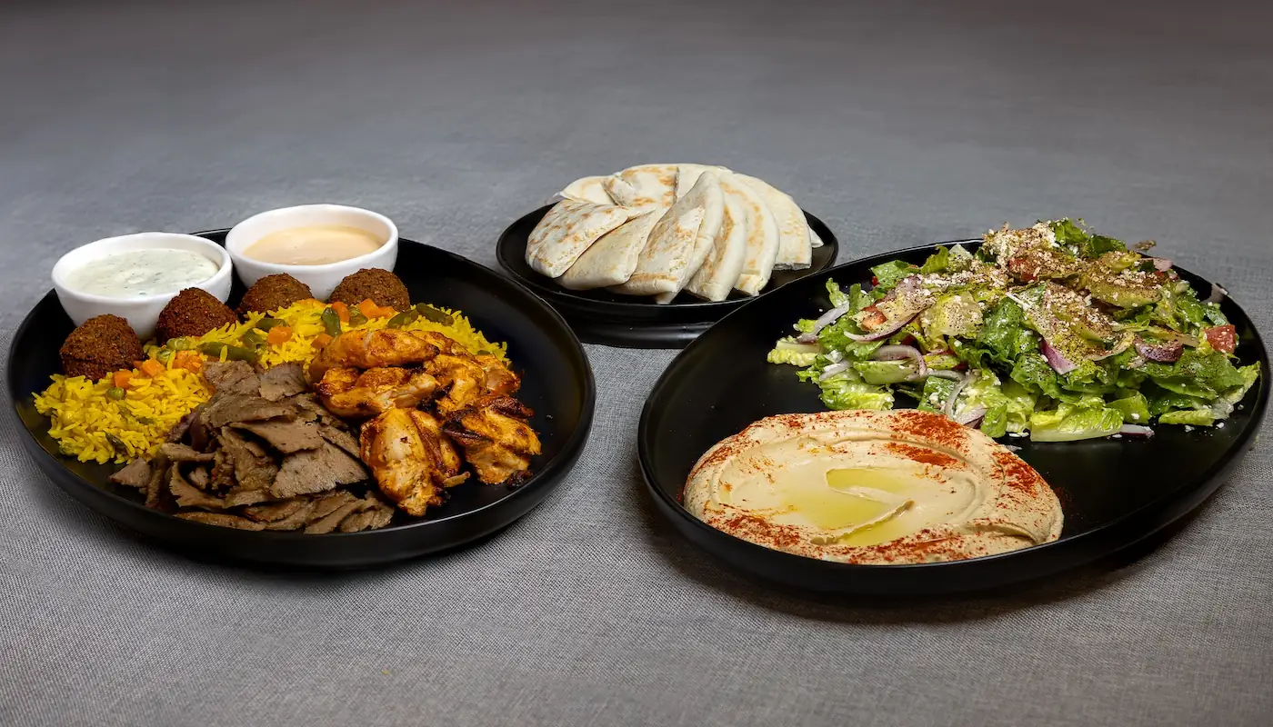 Micheline’s Pita House Family Meal with Mediterranean sides, pitas and proteins